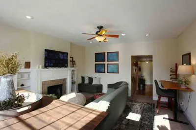 a living room with a couch and a fireplace at The Loft Downtown in Chillicothe