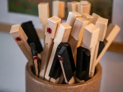 a wooden cup filled with pens and pencils at Classic Meets Contemporary I Minutes to Cle Clinic in Cleveland Heights