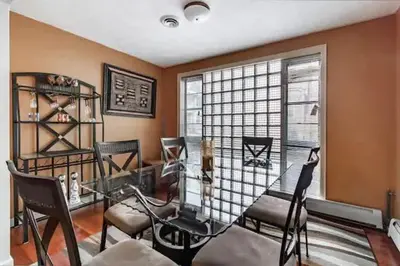 a room with chairs and a table and a window at Spacious Family Getaway - Near Cleveland Clinic in Cleveland