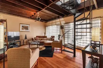a living room with a couch and a tv at Spacious Family Getaway - Near Cleveland Clinic in Cleveland