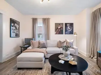 a living room with a couch and a table at Newly Renovated - Professionally Designed - 2 BR in Lakewood