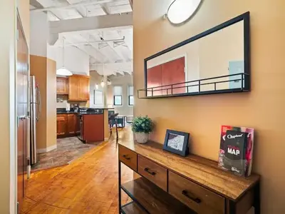 an office with a large mirror on the wall at Lakefront Loft - Walk 2 First Energy x Progressive in Cleveland