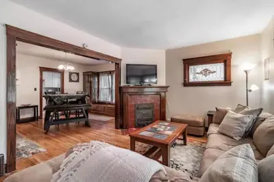 a living room with a couch and a piano at Lakewood Bed & Biscuit - Pet Friendly - Mins to LKWD Park in Lakewood