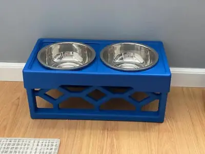 a blue box with two stainless steel bowls in it at Lakewood Bed & Biscuit - Pet Friendly - Mins to LKWD Park in Lakewood