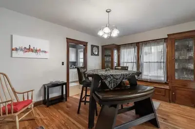 a living room with a dining room table and chairs at Lakewood Bed & Biscuit - Pet Friendly - Mins to LKWD Park in Lakewood