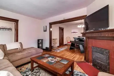 a living room with a couch and a fireplace at Lakewood Bed & Biscuit - Pet Friendly - Mins to LKWD Park in Lakewood