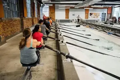 a group of people in a factory working on chickens at Spacious Riverfront Suite - Close to Downtown in Cleveland