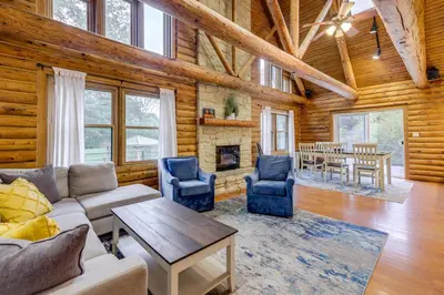 a living room with a couch and chairs and a fireplace at On-Site Lake and Gazebo Cabin in Yellow Springs! in Fairborn