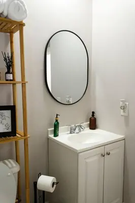 a bathroom with a sink and a mirror at Lizzys Haven in Cincinnati