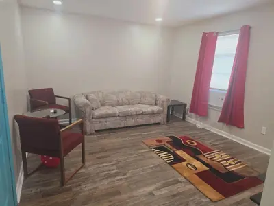 a living room with a couch and a chair at Comfy 1BR Apt. in Pleasant Ridge in Cincinnati