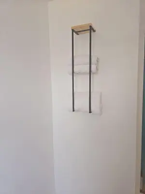 a bathroom with white towels on a towel rack at Comfy 1BR Apt. in Pleasant Ridge in Cincinnati