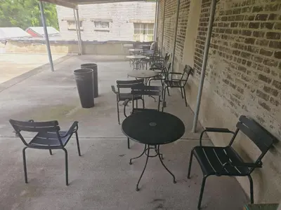 a row of tables and chairs in a building at Cozy 1BR in Pleasant Ridge in Cincinnati