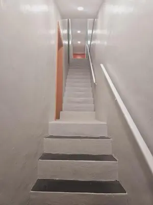 a staircase in a building with a stair case at Cozy 1BR in Pleasant Ridge in Cincinnati