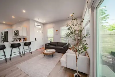 a living room with a couch and a table at Hot Tub Amazing Location! Modern Ohio City Luxury 2 King Beds in Ohio City