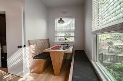 a kitchen with a table in a room with a window at Hot Tub Amazing Location! Modern Ohio City Luxury 2 King Beds in Ohio City