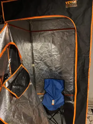 a tent with a blue chair inside it at Spacious Relaxing Baltimore Home with Hot Tub in Baltimore