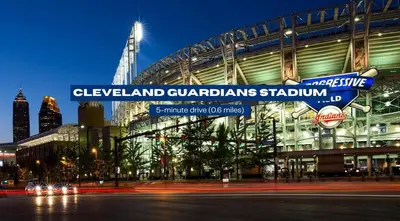 a street sign in front of a stadium at night at Spacious Downtown Sq Stadium, Casino, R&R HoF in Cleveland