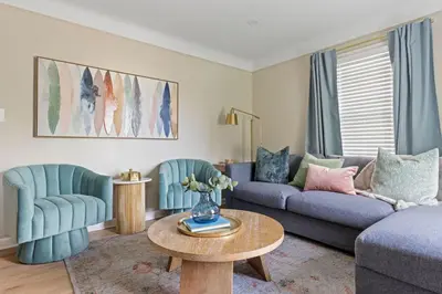 a living room with a couch and two chairs and a table at 27150 Forestview Ave, Euclid in Euclid
