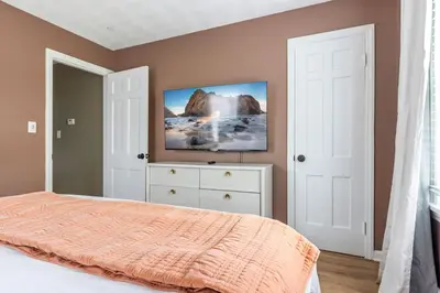a bedroom with a bed and a painting on the wall at 27150 Forestview Ave, Euclid in Euclid