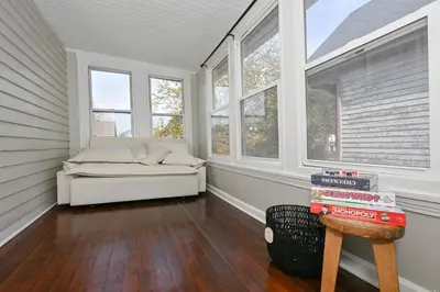 a room with a couch in a room with windows at Spacious 3-Bed In Vibrant Tremont in Cleveland