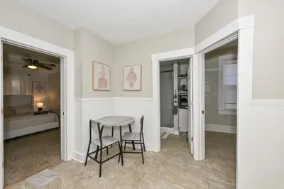 a dining room with a table and two chairs at 3 Bed Spacious 1st Floor Apt at Tremont in Cleveland