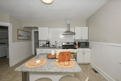 a kitchen with a table with a counter top at 3 Bed Spacious 1st Floor Apt at Tremont in Cleveland