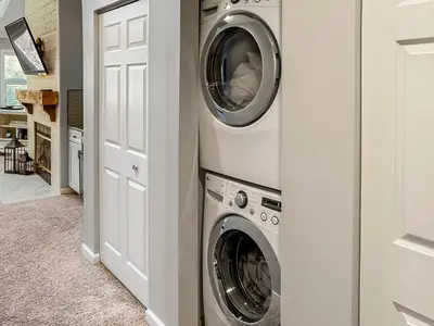 a laundry room with a washer and dryer at New! Kelleys Island Condo in Kelleys Island