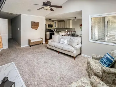 a living room with a couch and a table at New! Kelleys Island Condo in Kelleys Island