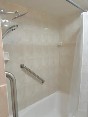 a bathroom with a shower with a shower curtain at Beautiful 2 BDRM Ocean Inspired Oasis in Youngstown