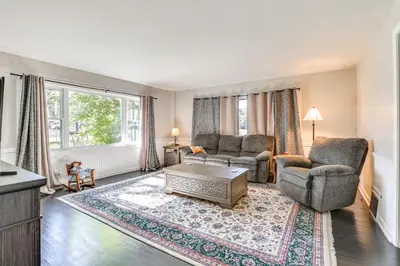 a living room with two chairs and a coffee table at Large Yard and Fire Pit Pet-Friendly Ravenna Home! in Streetsboro