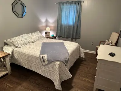 a bedroom with a bed and a window at Cozy apartment embedded in Kentucky mountains in Hagerhill