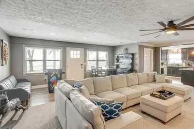 a living room with a couch and a ceiling fan at 5 Mi to Lake Port Clinton Home with Gazebo and Grill! in Port Clinton