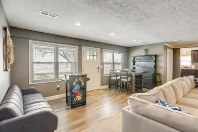 a living room with a couch and a table at 5 Mi to Lake Port Clinton Home with Gazebo and Grill! in Port Clinton