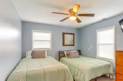 a bedroom with two beds and a ceiling fan at 5 Mi to Lake Port Clinton Home with Gazebo and Grill! in Port Clinton