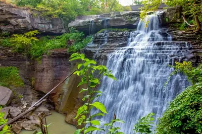 a waterfall on the side of a rocky cliff at Cuyahoga Valley NP, Dog Friendly, Boston Mills Ski in Brecksville