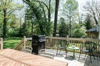 a patio with a grill and chairs on a deck at Cuyahoga Valley NP, Dog Friendly, Boston Mills Ski in Brecksville