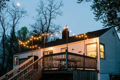 a house with a deck with lights on it at Cuyahoga Valley NP, Dog Friendly, Boston Mills Ski in Brecksville