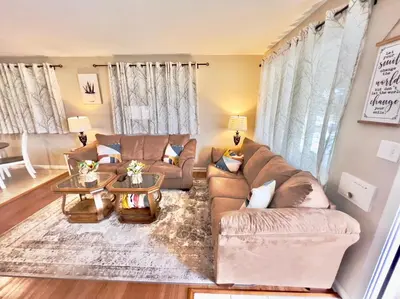 a living room with a couch and a table at Sunny Stay Bright and Cozy Suite 2 in Cincinnati