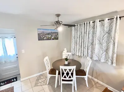 a dining room with a table and chairs at Sunny Stay Bright and Cozy Suite 2 in Cincinnati
