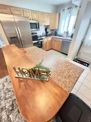 a kitchen with a wooden counter top in a kitchen at Sunny Stay Bright and Cozy Suite 2 in Cincinnati