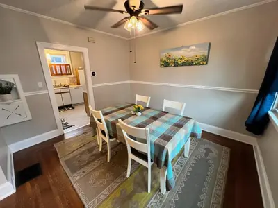 a dining room with a table and chairs at Cozy Bungalow Quiet Neighborhood Queen Bed Suite 3 10 Min to Downtown in Cincinnati