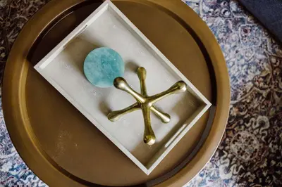 a plate with a gold cross and a ball on it at Heights Sweet - Libby Unit 7 in Maple Heights