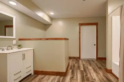 an empty bathroom with a sink and a door at Tranquil Heights Cabin in Hocking Hills in Ray