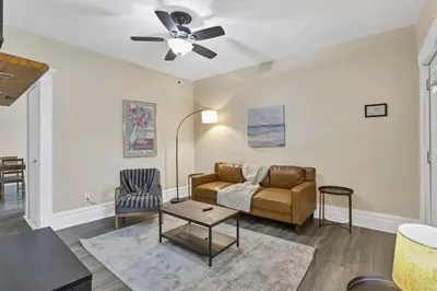 a living room with a couch and a table at The Rich Street Getaway in Columbus