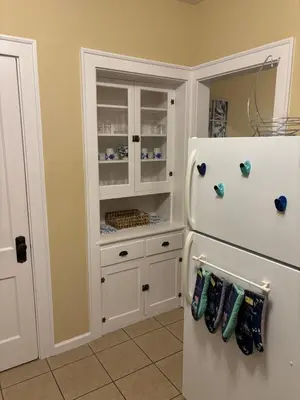 a kitchen with a white refrigerator and a pantry at Charming 1 BR Apt 6 miles from Downtown! in Cincinnati