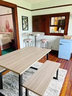 a room with two wooden tables and two stools at Pendleton Getaway in Pendleton