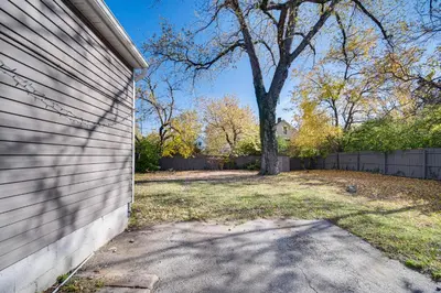 a side of a house with a tree in a yard at 8 Mi to Dtwn Cleveland Family Home in Cleveland