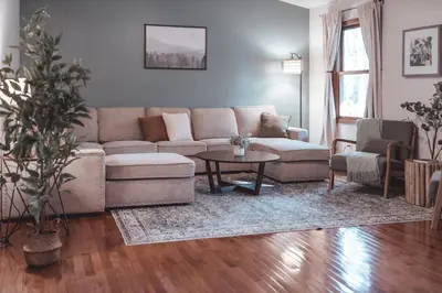a living room with a couch and a table at Bigfoot's Hideout - A Hocking Hills Escape in Logan