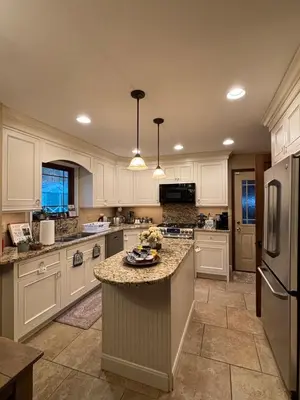 a kitchen with white cabinets and a granite counter top at Bluegrass Resort - Nature rich escape, Between the Creation & ARK, Fully equipped kitchen, Pet friendly, Fire pit in Union