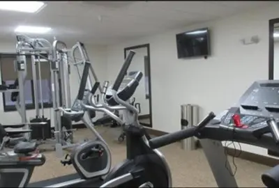 a gym with several cardio machines in a room at Comfort Inn & Suites Caldwell in Caldwell